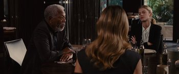 Movie still from “Now You See Me” (2013), directed by Louis Leterrier – A man and a woman are sitting at a table; Medium shot, Over the shoulder angle