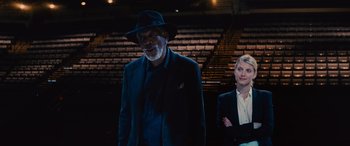Movie still from “Now You See Me” (2013), directed by Louis Leterrier – A man and a woman standing in front of an audience; Medium shot, Low angle