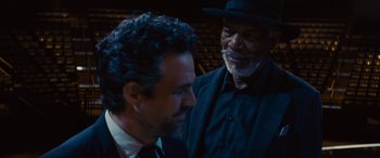 Movie still from “Now You See Me” (2013), directed by Louis Leterrier – A man in a suit and a man in a hat; Close Up shot, Over the shoulder angle