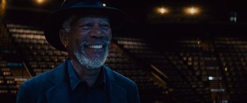 Movie still from “Now You See Me” (2013), directed by Louis Leterrier – An older man with a gray beard wearing a blue hat; Close Up shot, Low angle