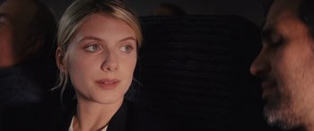Movie still from “Now You See Me” (2013), directed by Louis Leterrier – A woman's face in the dark; Close Up shot, Over the shoulder angle
