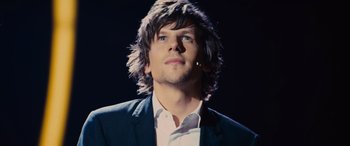 Movie still from “Now You See Me” (2013), directed by Louis Leterrier – A person wearing a suit; Close Up shot, Low angle