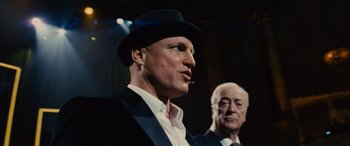 Movie still from “Now You See Me” (2013), directed by Louis Leterrier – A man in a suit and a man in a top hat; Close Up shot, Low angle
