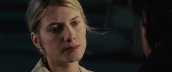 Movie still from “Now You See Me” (2013), directed by Louis Leterrier – A woman's face in a dark room; Close Up shot, Over the shoulder angle