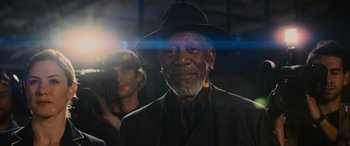 Movie still from “Now You See Me” (2013), directed by Louis Leterrier – An older man wearing a black hat and a black suit; Close Up shot, Low angle