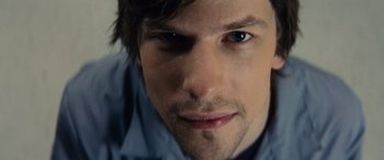 Movie still from “Now You See Me” (2013), directed by Louis Leterrier – A man's face with blue eyes; Extreme Close Up shot, Overhead angle