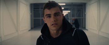 Movie still from “Now You See Me” (2013), directed by Louis Leterrier – A young man in a black hoodie in an empty room; Close Up shot, Over the shoulder angle