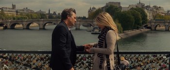 Movie still from “Now You See Me” (2013), directed by Louis Leterrier – A man and a woman holding hands on a bridge; Medium shot, Over the shoulder angle