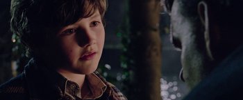 Movie still from “Now You See Me 2” (2016), directed by Jon M. Chu – A young boy is looking into the camera; Close Up shot, Over the shoulder angle