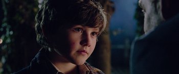 Movie still from “Now You See Me 2” (2016), directed by Jon M. Chu – A young boy is looking into the distance; Close Up shot, Over the shoulder angle