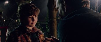 Movie still from “Now You See Me 2” (2016), directed by Jon M. Chu – A man and a boy are looking at each other; Close Up shot, Over the shoulder angle