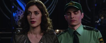 Movie still from “Now You See Me 2” (2016), directed by Jon M. Chu – A man and a woman standing next to each other; Close Up shot, Over the shoulder angle