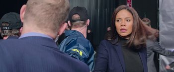 Movie still from “Now You See Me 2” (2016), directed by Jon M. Chu – A woman in a black jacket is standing next to a man in a blue jacket; Medium shot, Over the shoulder angle