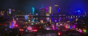 Movie still from “Now You See Me 2” (2016), directed by Jon M. Chu – A city lit up at night with lights and buildings; Extreme Wide shot, High angle