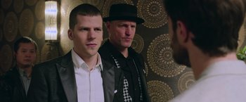 Movie still from “Now You See Me 2” (2016), directed by Jon M. Chu – Two men in suits and hats posing for a picture; Close Up shot, Over the shoulder angle