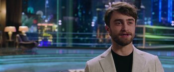 Movie still from “Now You See Me 2” (2016), directed by Jon M. Chu – A person wearing a suit; Close Up shot, Over the shoulder angle