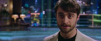 Movie still from “Now You See Me 2” (2016), directed by Jon M. Chu – A person wearing a jacket; Close Up shot, Over the shoulder angle