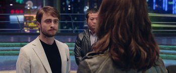 Movie still from “Now You See Me 2” (2016), directed by Jon M. Chu – A group of men and women standing next to each other; Close Up shot, Over the shoulder angle