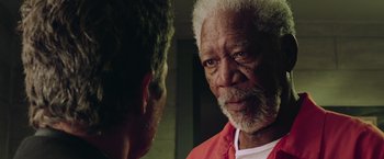 Movie still from “Now You See Me 2” (2016), directed by Jon M. Chu – A man with a white beard is talking to another man; Close Up shot, Over the shoulder angle