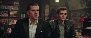 Movie still from “Now You See Me 2” (2016), directed by Jon M. Chu – A couple of men standing next to each other; Medium shot, Over the shoulder angle