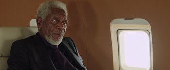 Movie still from “Now You See Me 2” (2016), directed by Jon M. Chu – An older man sitting on top of an airplane; Close Up shot, High angle