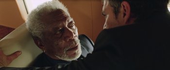 Movie still from “Now You See Me 2” (2016), directed by Jon M. Chu – An older man and a younger man looking at each other; Close Up shot, Over the shoulder angle