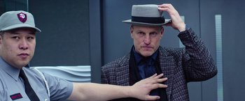 Movie still from “Now You See Me 2” (2016), directed by Jon M. Chu – A man wearing a hat and a suit; Close Up shot, Over the shoulder angle