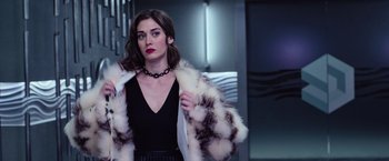 Movie still from “Now You See Me 2” (2016), directed by Jon M. Chu – A woman in a black top and a white and black fur coat; Medium shot, Low angle