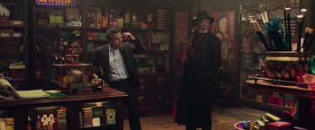 Movie still from “Now You See Me 2” (2016), directed by Jon M. Chu – Two men standing in a room next to each other; Medium shot, Over the shoulder angle