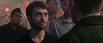 Movie still from “Now You See Me 2” (2016), directed by Jon M. Chu – A group of men standing around a room; Close Up shot, Over the shoulder angle