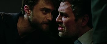 Movie still from “Now You See Me 2” (2016), directed by Jon M. Chu – Two men face to face with one of them looking at the other; Close Up shot, Over the shoulder angle