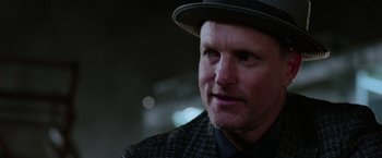 Movie still from “Now You See Me 2” (2016), directed by Jon M. Chu – A person wearing a hat; Close Up shot, Over the shoulder angle
