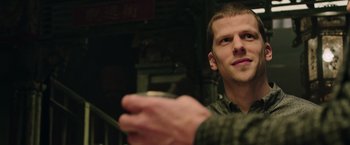 Movie still from “Now You See Me 2” (2016), directed by Jon M. Chu – A person holding a cup in his hand; Close Up shot, Over the shoulder angle