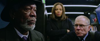 Movie still from “Now You See Me 2” (2016), directed by Jon M. Chu – An older man and a woman on a bus; Close Up shot, Low angle