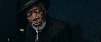 Movie still from “Now You See Me 2” (2016), directed by Jon M. Chu – An older man wearing a suit and a hat; Close Up shot, High angle