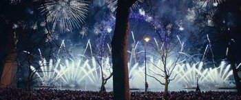 Movie still from “Now You See Me 2” (2016), directed by Jon M. Chu – A crowd of people watching fireworks in a park; Extreme Wide shot, High angle
