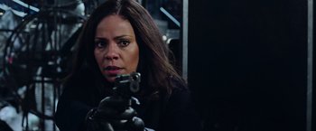 Movie still from “Now You See Me 2” (2016), directed by Jon M. Chu – A woman is holding a gun in her hand; Close Up shot, Low angle