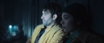 Movie still from “Nowhere” (2023), directed by Albert Pintó – A man and a woman sitting next to each other; Close Up shot, Low angle