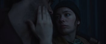Movie still from “Nowhere” (2023), directed by Albert Pintó – A man and a woman looking at each other in the dark; Close Up shot, Low angle