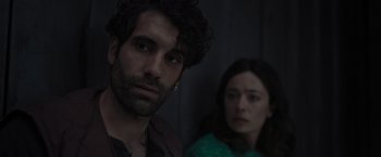 Movie still from “Nowhere” (2023), directed by Albert Pintó – A man and a woman standing next to each other; Close Up shot, Over the shoulder angle