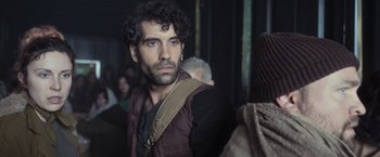 Movie still from “Nowhere” (2023), directed by Albert Pintó – A person wearing a vest; Close Up shot, Over the shoulder angle