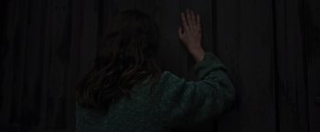 Movie still from “Nowhere” (2023), directed by Albert Pintó – A woman with her hand up in the air; Close Up shot, Over the shoulder angle