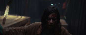 Movie still from “Nowhere” (2023), directed by Albert Pintó – A woman with a bandage on her head and face; Close Up shot, Over the shoulder angle