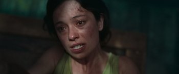 Movie still from “Nowhere” (2023), directed by Albert Pintó – A person with a bruise on her face; Close Up shot, High angle