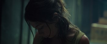 Movie still from “Nowhere” (2023), directed by Albert Pintó – A person with long hair; Close Up shot, Low angle