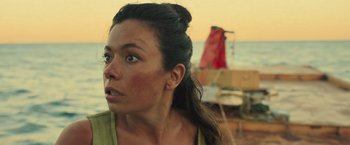 Movie still from “Nowhere” (2023), directed by Albert Pintó – A person on a boat in the water; Close Up shot, Low angle