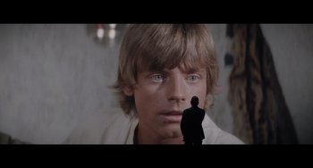 Movie still from “Obi-Wan Kenobi: A Jedi's Return” (2022), directed by David Gelb – A man standing in front of another man in front of a wall; Close Up shot, Low angle