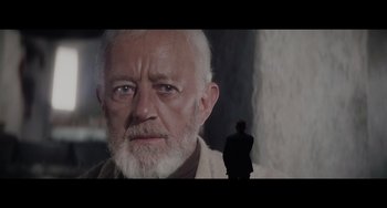 Movie still from “Obi-Wan Kenobi: A Jedi's Return” (2022), directed by David Gelb – An old man with a beard is looking into the camera; Medium shot, Over the shoulder angle