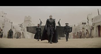 Movie still from “Obi-Wan Kenobi: A Jedi's Return” (2022), directed by David Gelb – A group of men standing next to each other; Wide shot, Low angle