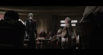 Movie still from “Obi-Wan Kenobi: A Jedi's Return” (2022), directed by David Gelb – A group of people sitting around a table; Wide shot, Over the shoulder angle